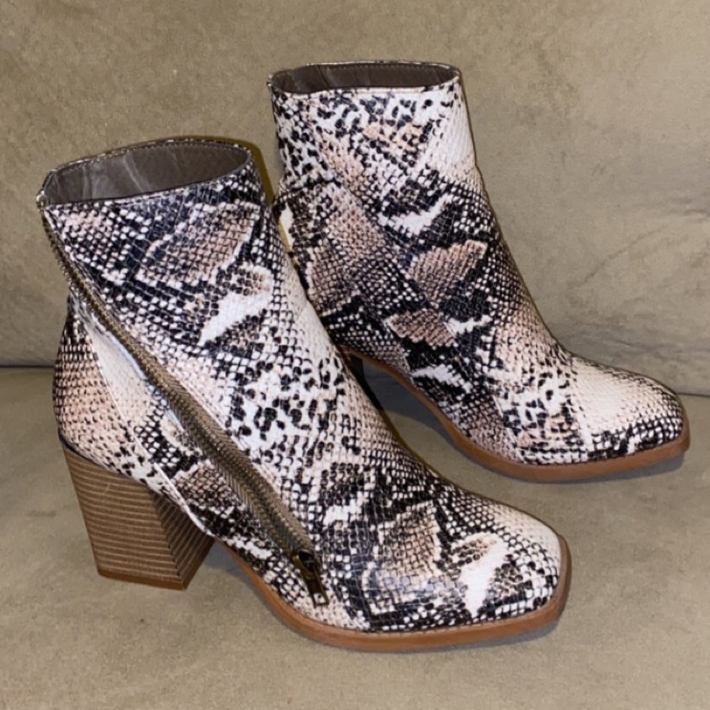 Snake skin print heeled boots